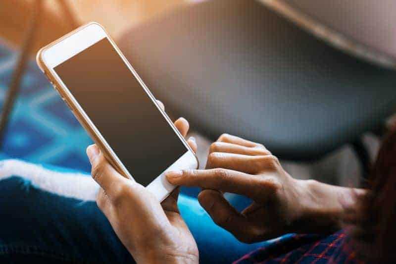 close up of woman using a cell phone