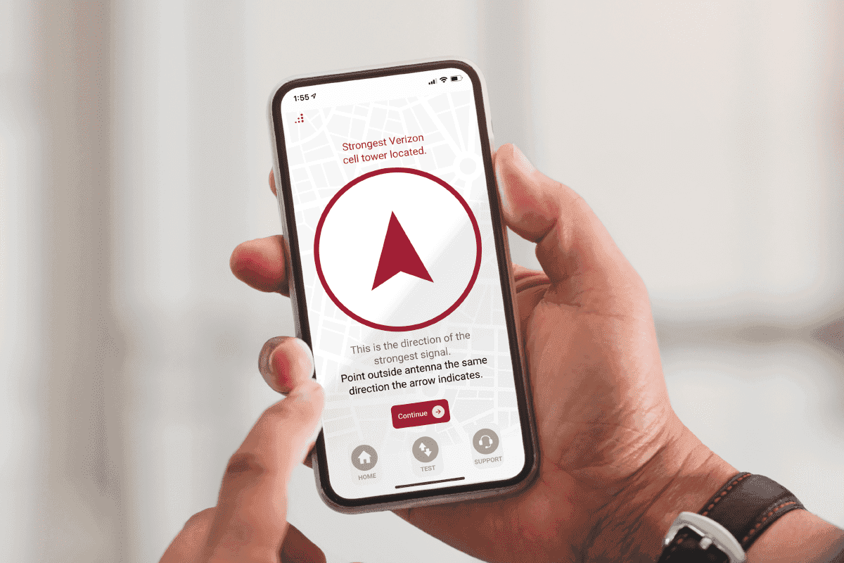 man using weBoost mobile app to find cell tower