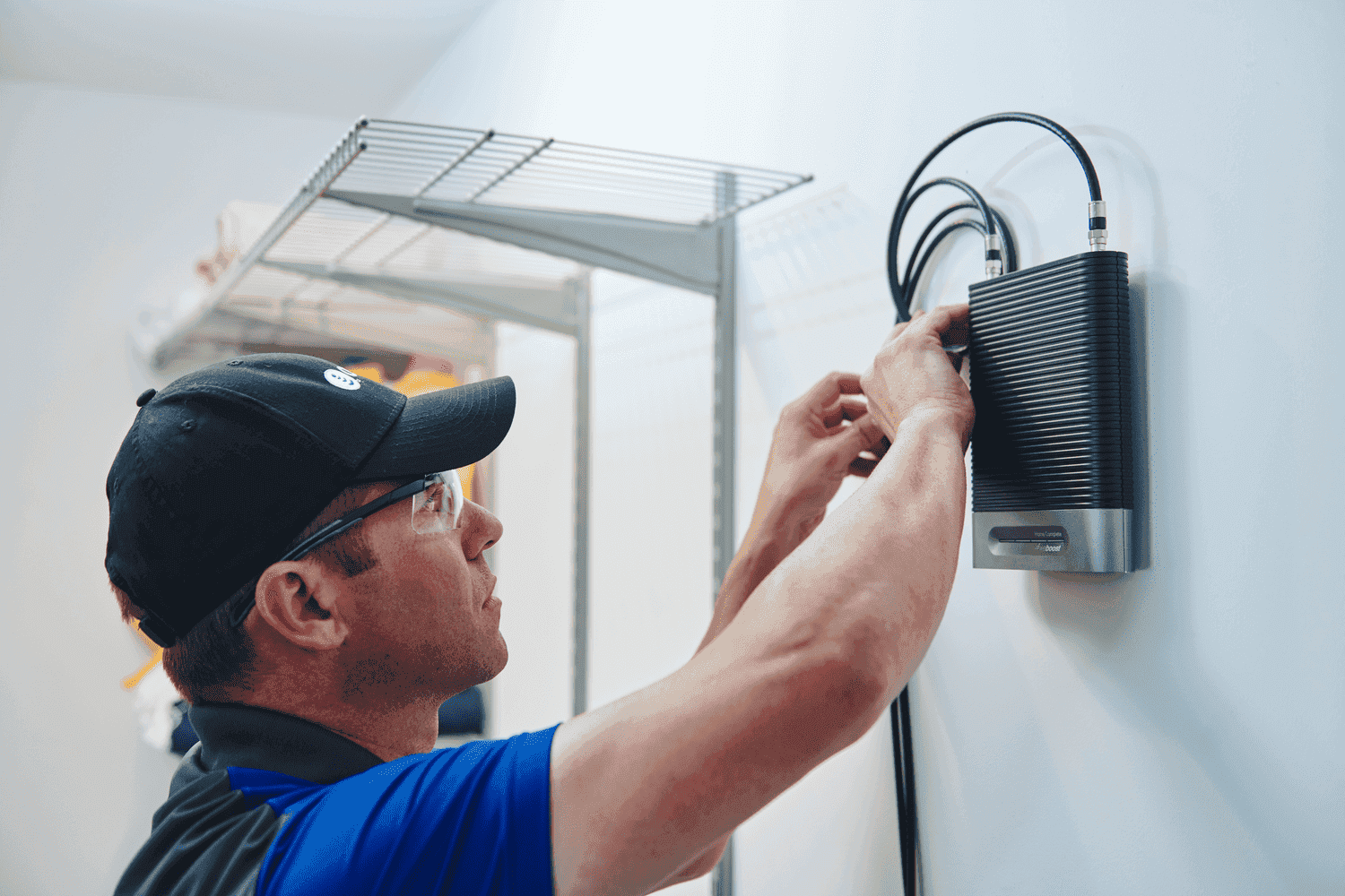 Certified installation of a cell signal booster in a business