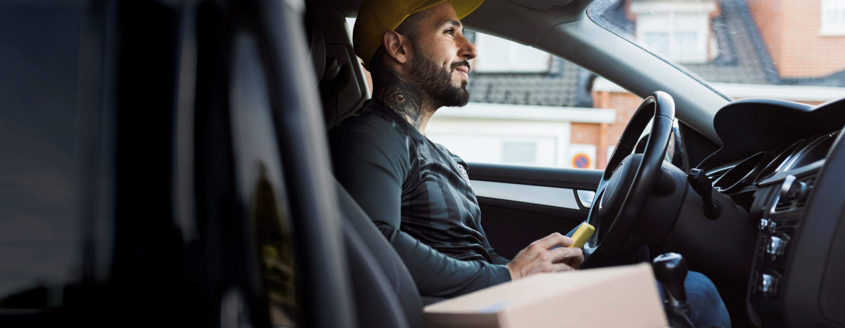 man using devices in vehicle