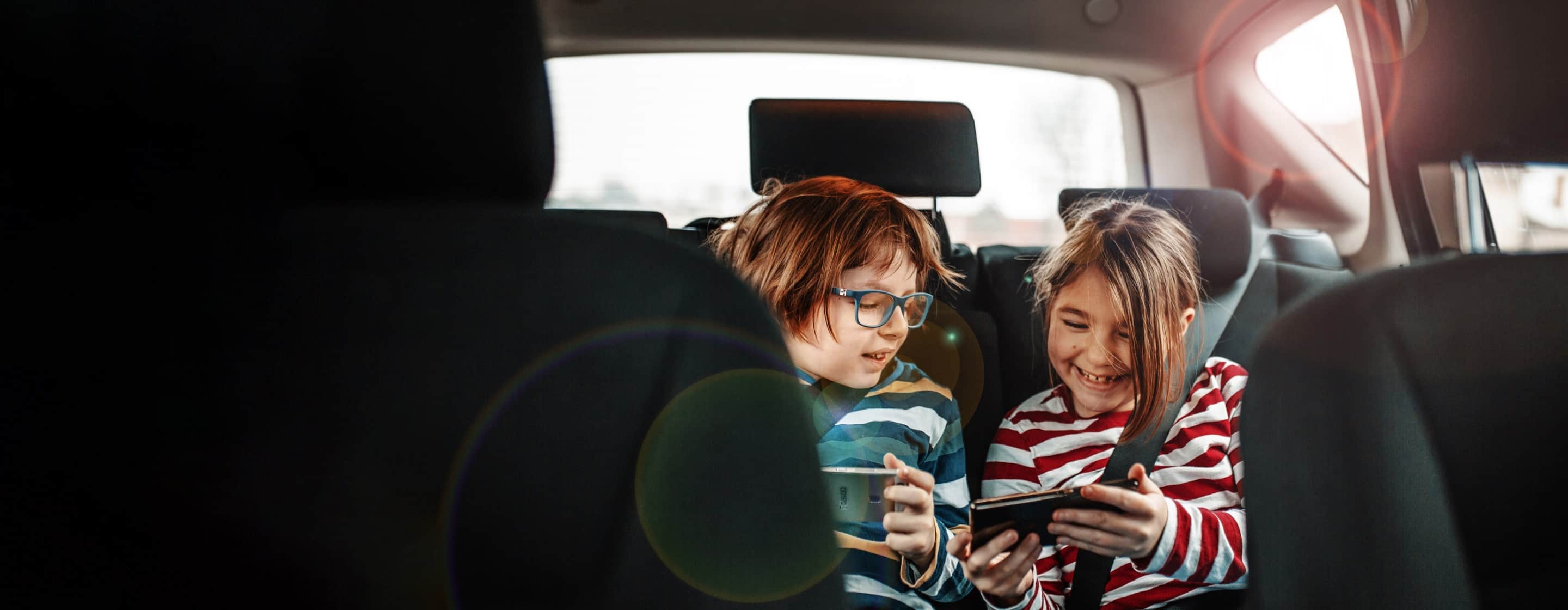 Kids having fun in back of car